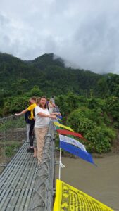 Guest on suspension bridge on Marsyangdi river